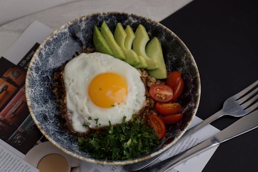 healthy breakfast bowl with eggs and vegetables